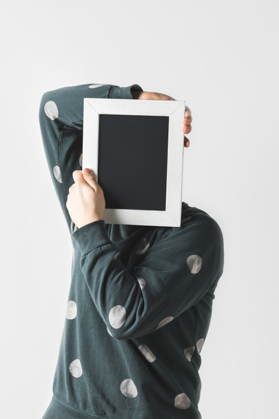 man covering face with black board isolated on white - Fotó, kép