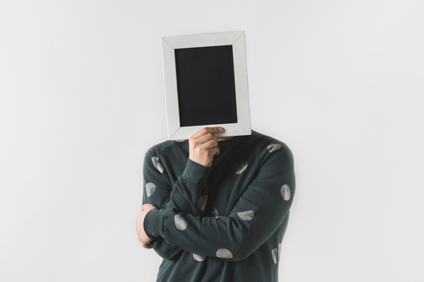 man covering face with black board isolated on white - Фото, изображение