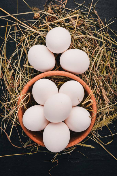 Chicken raw white eggs. On a wooden background. Top view. Copy space. - Foto, afbeelding