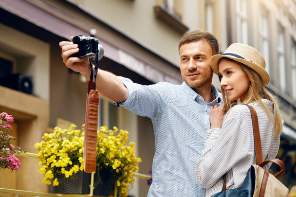 Tourist Couple In Love Taking Photos During Travel. - Photo, Image