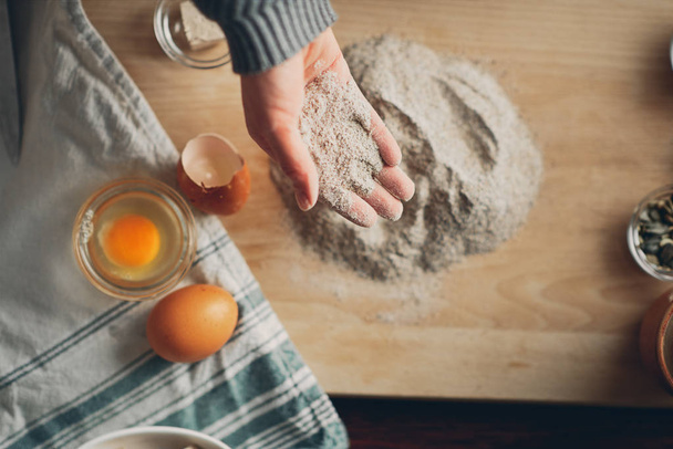 Close up of woman`s hands making a bread. - Fotó, kép