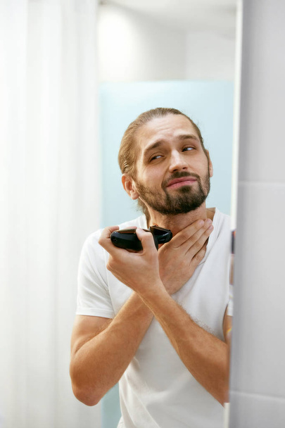 Man Shaving Face, Looking In Mirror. - Photo, image