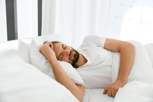 Man Sleeping On Bed In Morning. - Фото, изображение