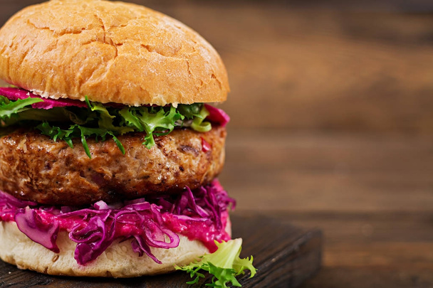 Sandwich hamburger with juicy burgers,  red cabbage and pink sauce - 写真・画像