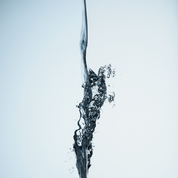 minimalistic background with water splash, isolated on white - Φωτογραφία, εικόνα