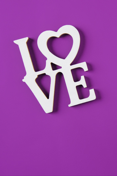 top view of word love isolated on purple, valentines day concept - Photo, Image