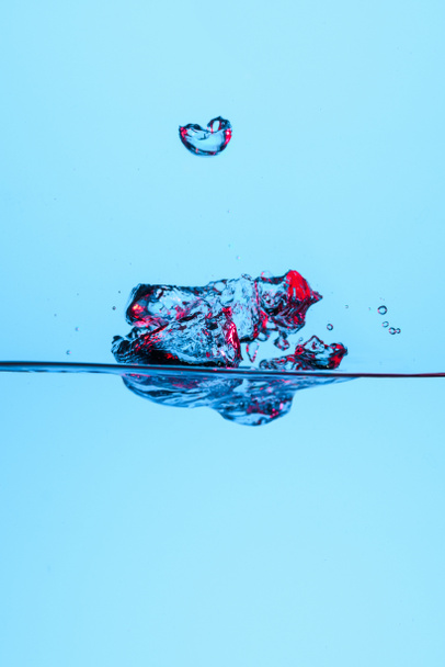 bubbles in clear water, isolated on blue - Foto, imagen