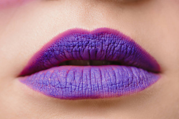 cropped image of female purple lips - Фото, изображение