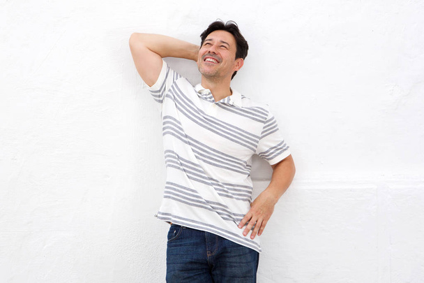Portrait of relaxed middle adult man leaning over white background - Photo, Image