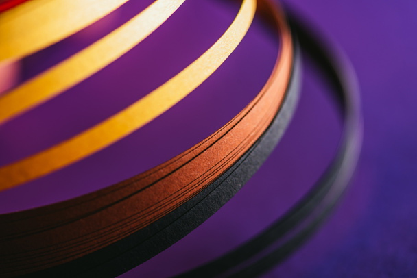 close up of yellow and black quilling paper curves on purple - Photo, Image