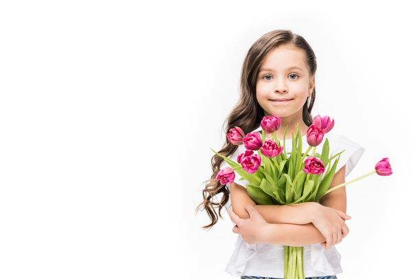 portrait of cute smiling child with bouquet of flowers in hands isolated on white, mothers day concept - Foto, Imagen