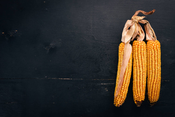 Dried corn on a wooden background. Top view. Copy space. - Fotó, kép