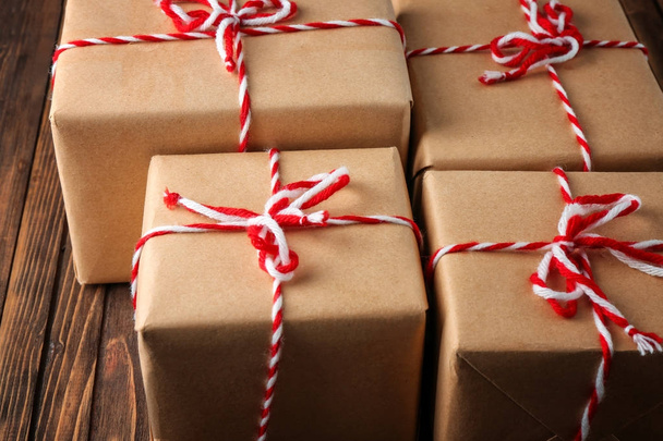 Parcel gift boxes on wooden table, closeup - Zdjęcie, obraz