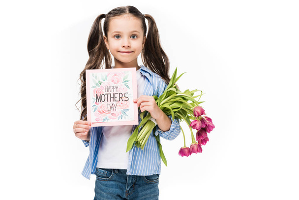 portrait of little kid with happy mothers day postcard and bouquet of flowers isolated on white - Fotó, kép
