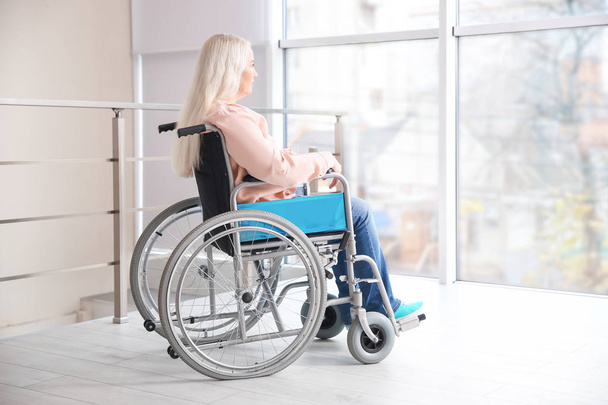 Mature woman in wheelchair indoors - Foto, Imagem