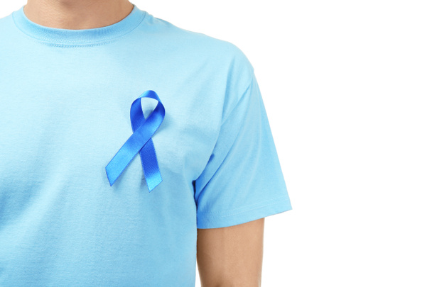 Man with blue ribbon on white background, closeup. Prostate cancer awareness - Фото, зображення