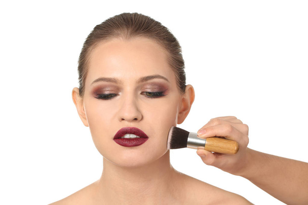 visage artist applying makeup on face  - Fotografie, Obrázek