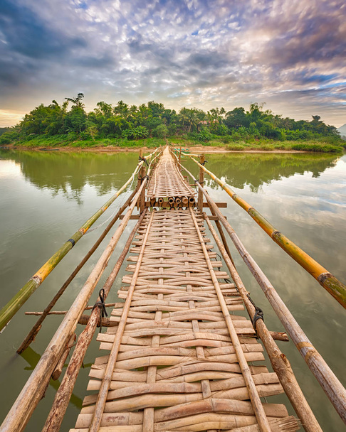 Beautiful view of a bamboo bridge. Laos landscape.  - Фото, изображение