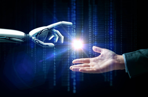 robot and human hand flash light and binary code - Foto, Imagen