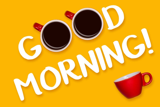 Phrase Good morning on a yellow background. Red cup on yellow. View from above - Foto, Imagen
