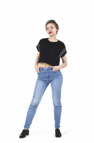 Young girl posing in jeans. - Фото, изображение
