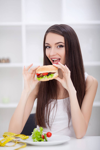 Diet. Dieting concept. Girl choosing healthy vs junk food. - Photo, Image