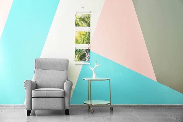 Modern armchair in room with minimalistic interior - 写真・画像