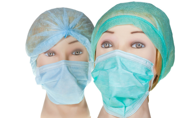 Думмі-лікар голова в текстильній хірургічній шапці та масці
 - Фото, зображення
