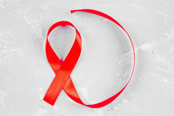 Red ribbon awareness for World aids day concept. - Fotografie, Obrázek