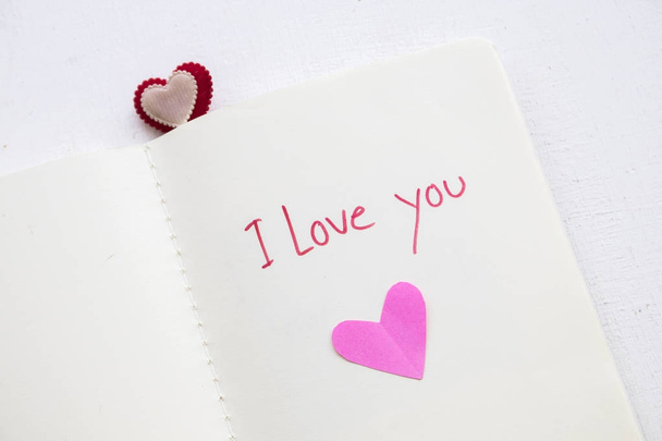 i love you message handwriting special word with pink heart paper on блокнот
 - Фото, изображение