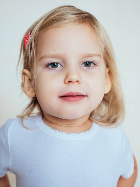 Portrait of emotional little girl. Happy blonde child - Fotó, kép