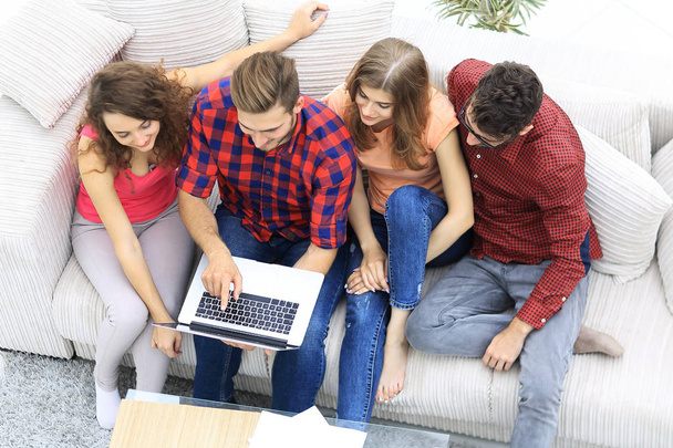 group of friends with a laptop,discussing the video - Photo, Image