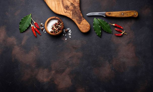 Cutting board with herbs and spices. Culinary background - Фото, изображение