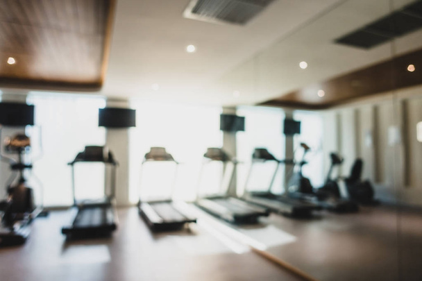 Abstract blur and defocused fitness equipment in gym interior - Photo, image