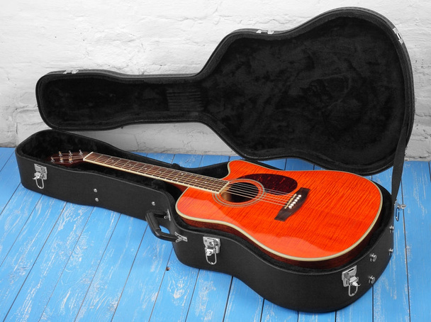 Musical instrument - Orange tiger maple acoustic guitar in hard  - Photo, Image