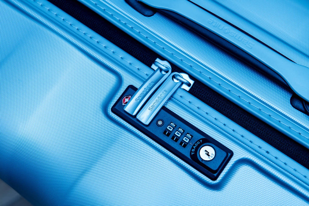 Samsonite suitcase briefcase with focus on the logo and TSA comb - Photo, Image