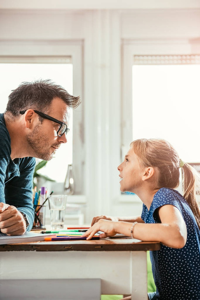 Daughter confronts to father about homework - Foto, Bild