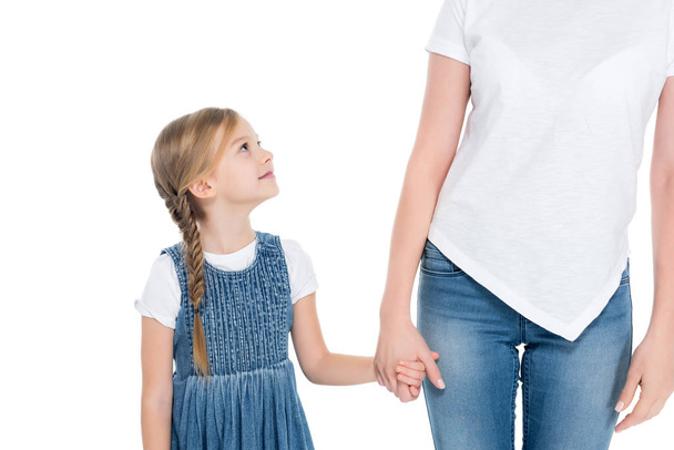 adorable daughter holding hands with mother, isolated on white - Foto, imagen
