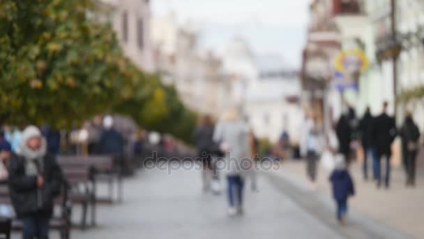 Shot of blurred, defocused people walking through town square - Footage, Video
