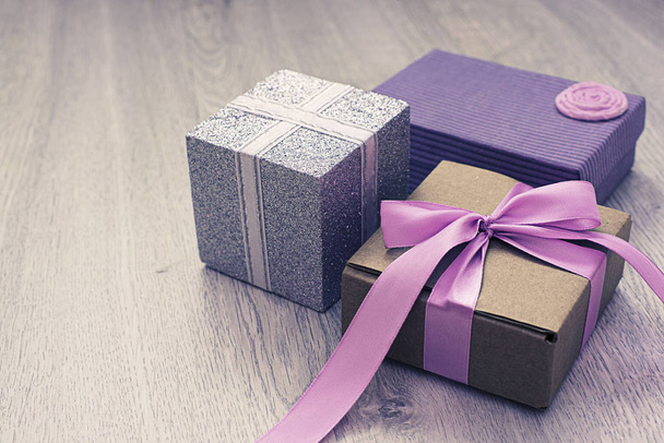 Decorative gift boxes on wooden background. - Photo, Image