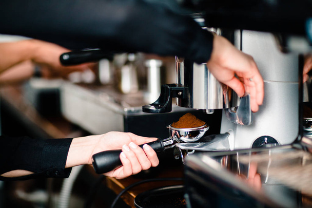 Stage 2, Coffee Cappuccino and Americano Espresso making, portafilter in grinder - Photo, Image