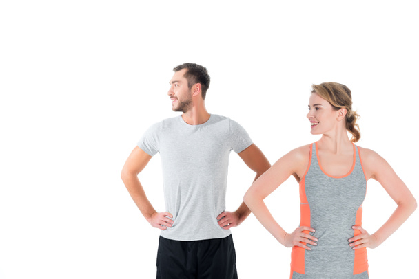 portrait of sportive couple warming up before training isolated on white - Fotoğraf, Görsel