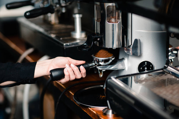 Coffee making, portafilter in grinder - Foto, Bild