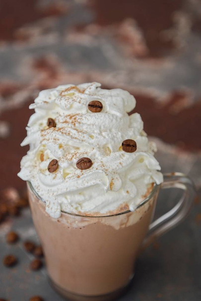 Delicious hot chocolate with whipped cream in glass cup - Фото, зображення