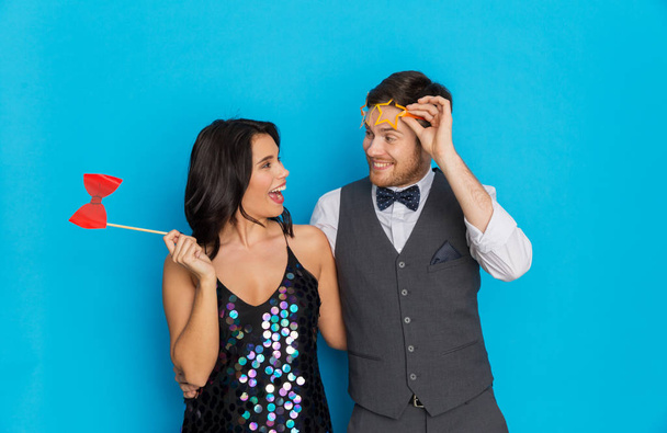 happy couple with party props having fun - Foto, imagen