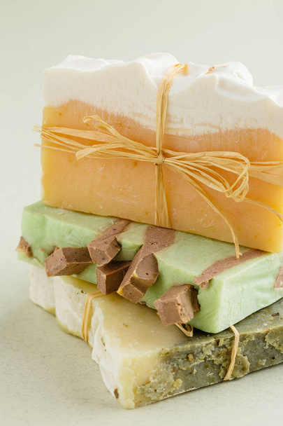 Bars of natural organic soap on green background - Fotografie, Obrázek