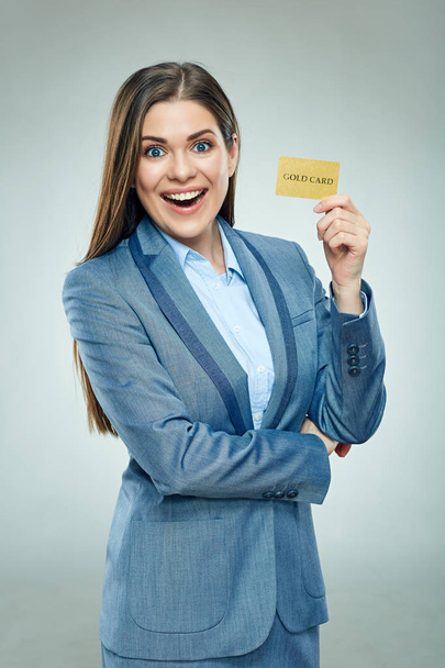 businesswoman in suit showing golden credit card  - Фото, изображение