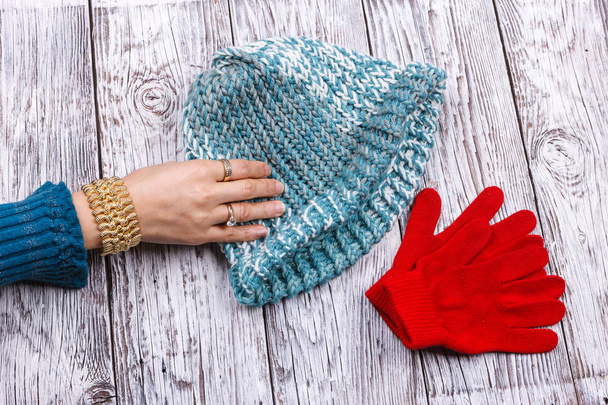 Reaching for her knit hat. - Photo, image