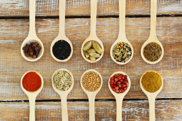 Selection of Indian spices on wooden spoons  - Photo, Image