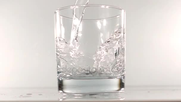 mineral water is poured into a glass slow motion - Materiaali, video